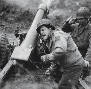 On the ground, artillerymen such as these firing a 105 mm M2A1 howitzer at Carentan, France, counted on the PCS's charts to account for the effects of range, elevation, muzzle velocity, weather, and other factors on the trajectory of their shells.