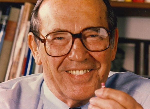 Rieveschl holding a Benadryl capsule, the medication that has provided allergy relief to millions worldwide. From the George Rieveschl, Jr. Papers of The Lloyd Library & Museum