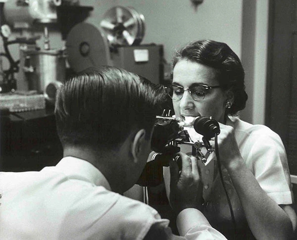 A technician checks Crest’s tooth cleaning ability using a microscope and ultraviolet light. Procter & Gamble