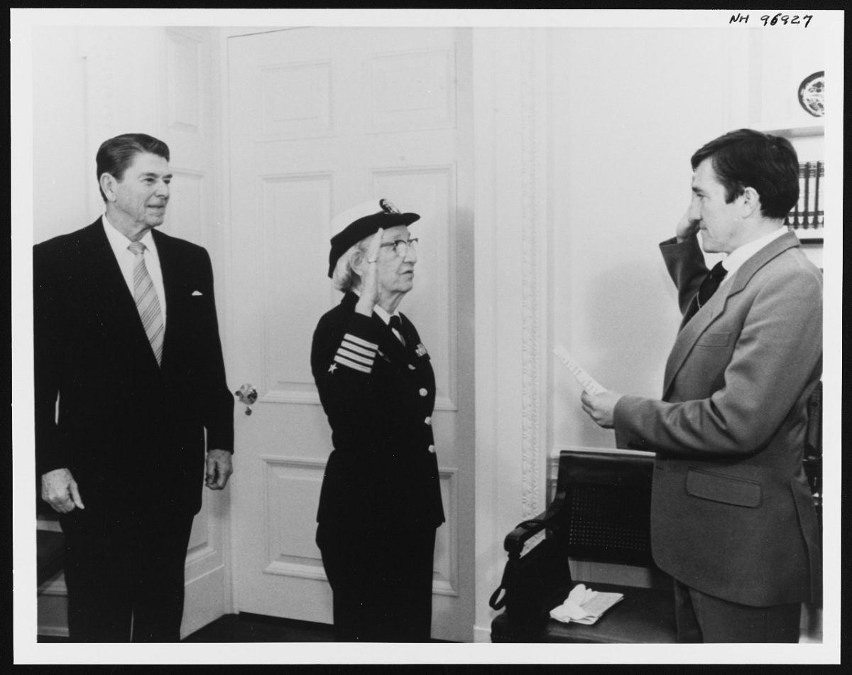 President Ronald Reagan looks on as Grace Hopper takes the oath of office from Secretary of the Navy John Lehman, during White House ceremonies promoting her from the rank of captain to commodore, Dec. 15, 1983., at left. Photo Credit: Pete Souza.