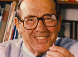 Rieveschl holding a Benadryl capsule, the medication that has provided allergy relief to millions worldwide. From the George Rieveschl, Jr. Papers of The Lloyd Library & Museum