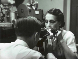 A technician checks Crest’s tooth cleaning ability using a microscope and ultraviolet light. Procter & Gamble